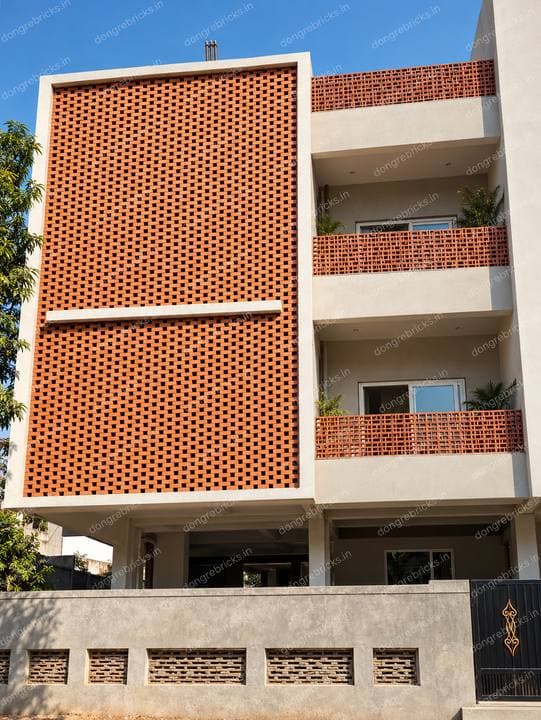 Large perforated brick screen panel and matching balcony screens