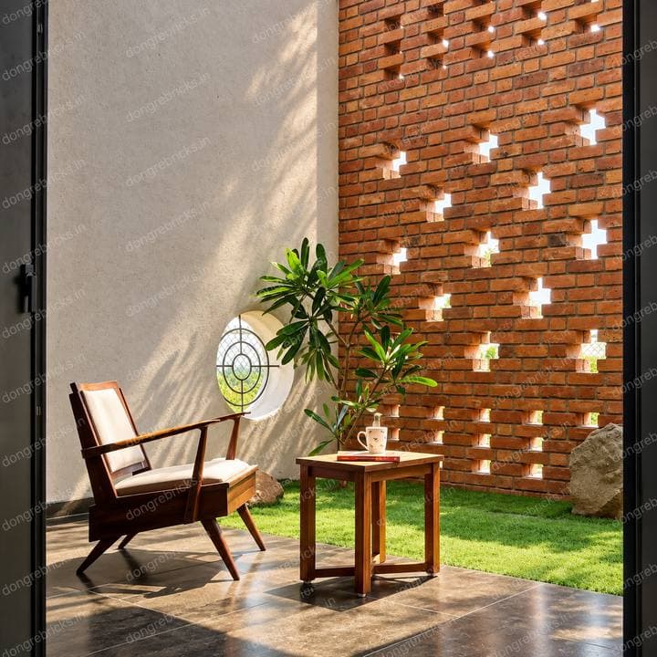 Interior courtyard wall with cross-shaped light perforations